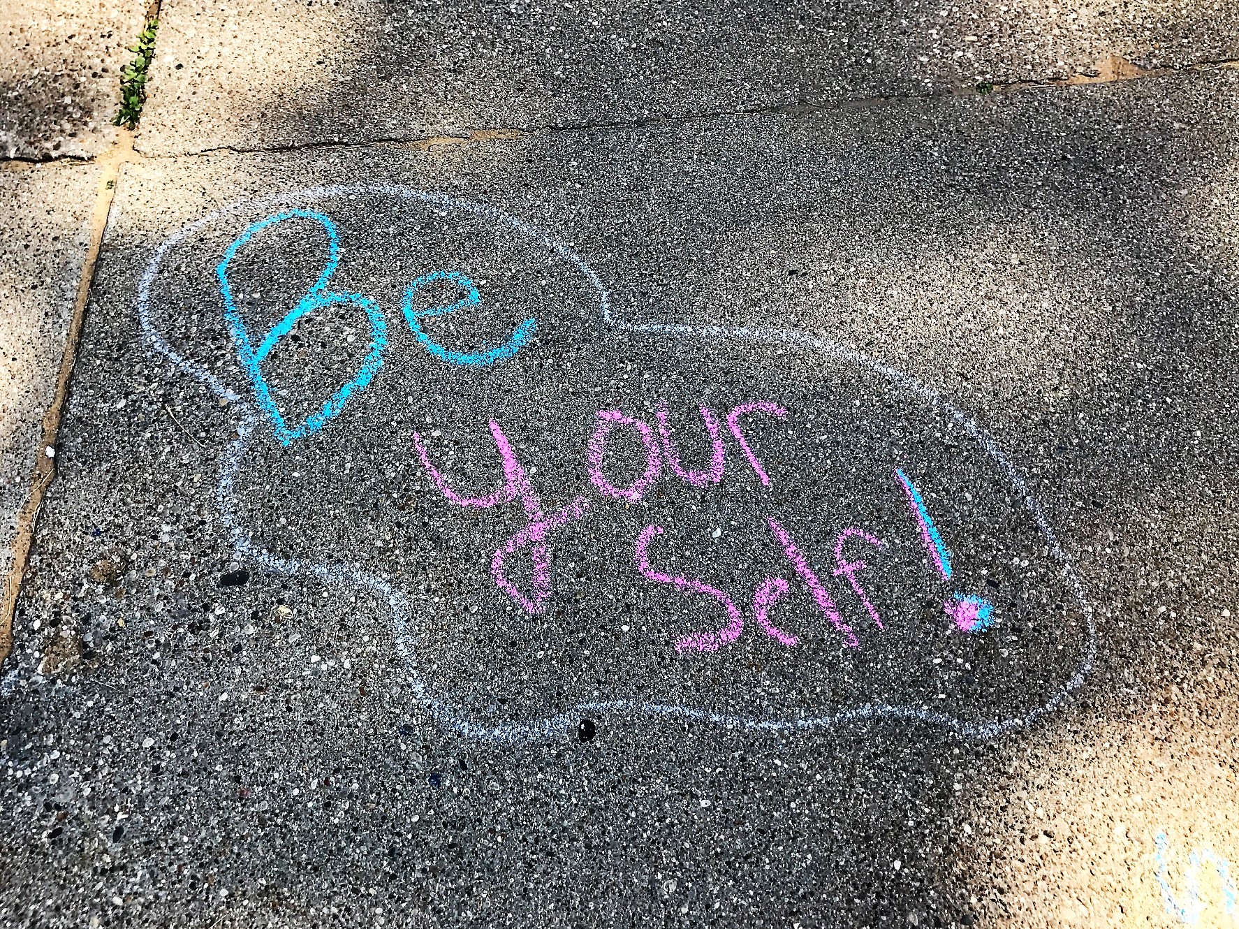 Chalk drawing on sidewalk, "Be yourself!"