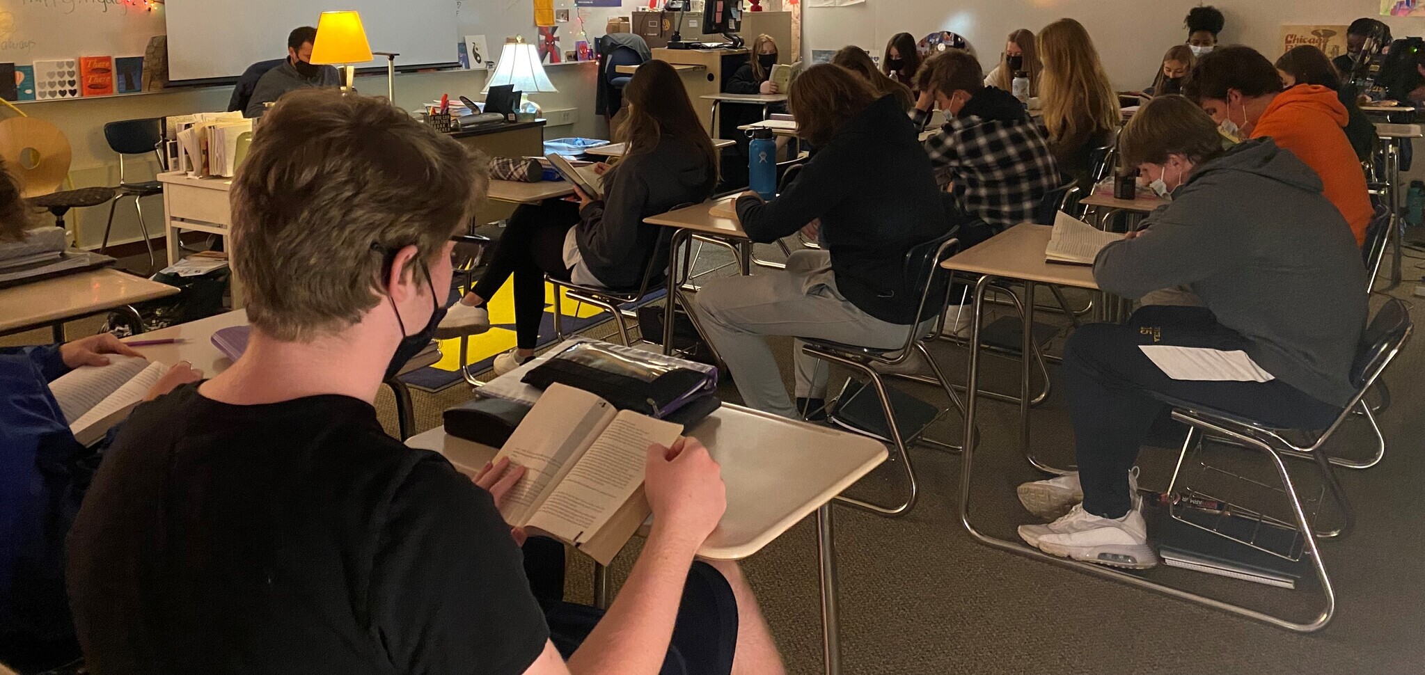 Mr. Parnin starts classes daily with students reading books in his ELA classes